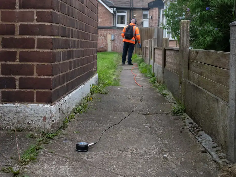 Ground microphone on a shared back path, tracing a leak on a shared supply pipe, Nottingham