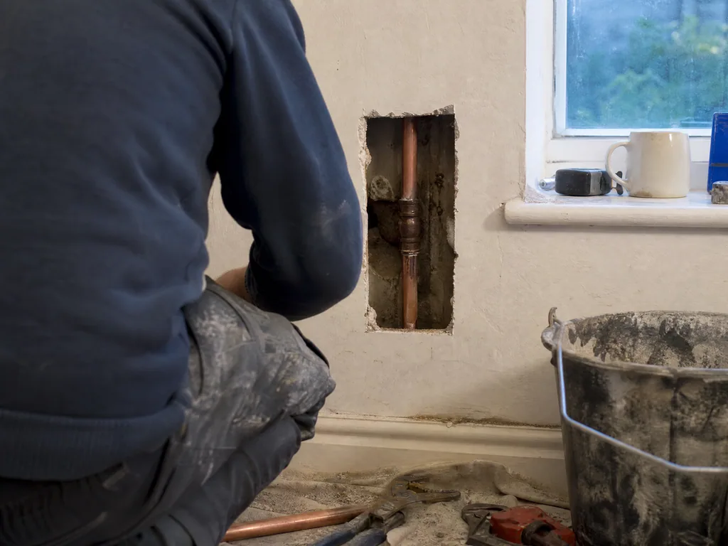 Small section of wall opened to reach a leaking copper pipe, Nottingham