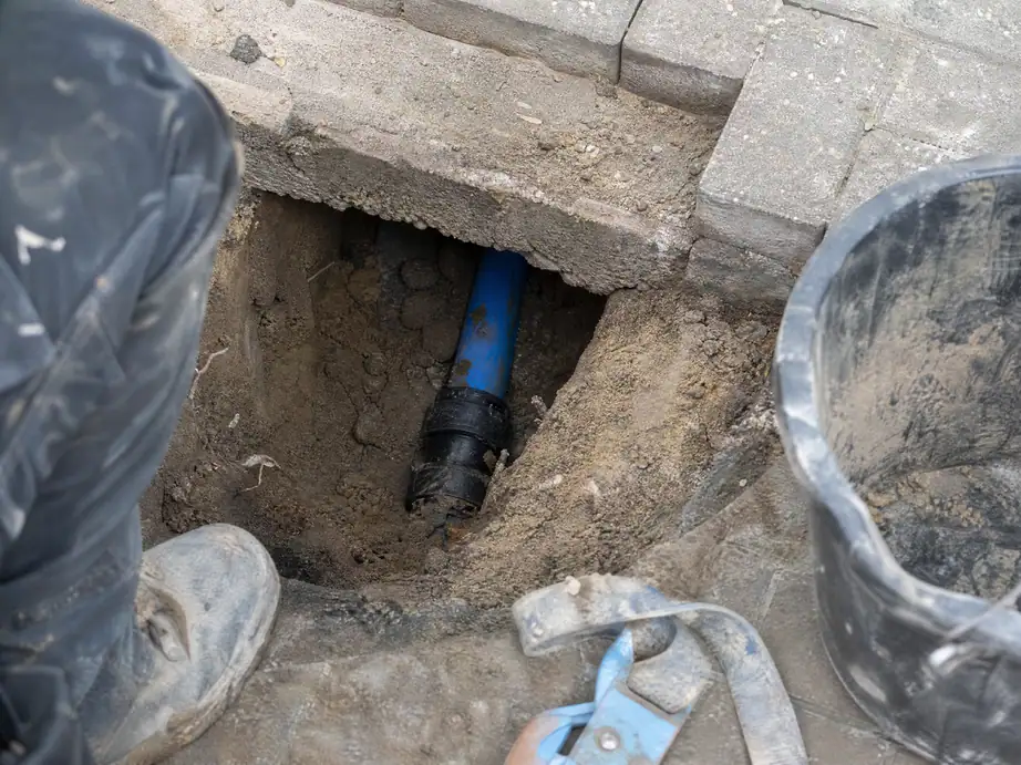 Repaired water supply pipe in a small hole under a driveway, Nottingham